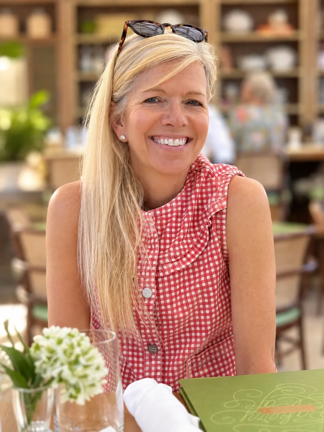 Annie Hagstrom, founder of Faith Mustard, smiling at a table